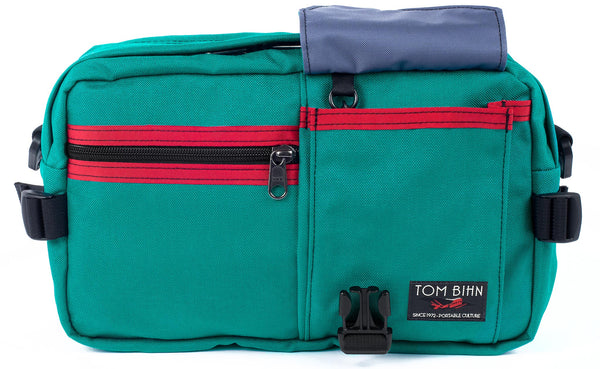The LGD in Mayura/Red/Dawn. Front view, front buckle pocket lifted up to show the Dawn lining.